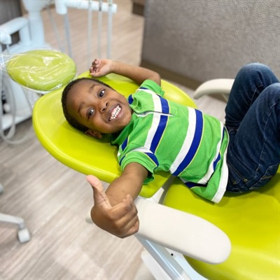 Phoenix patient in chair thumbs up